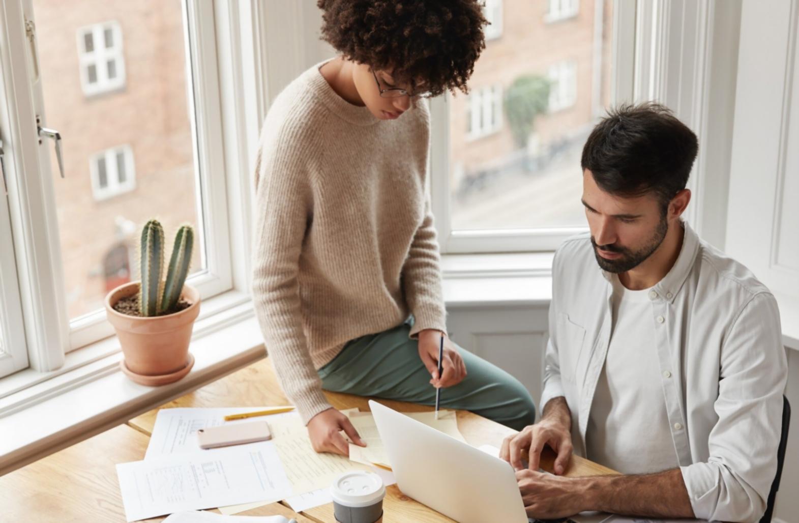 Professional testing coordination workspace showing multiple screens with test management tools and documentation